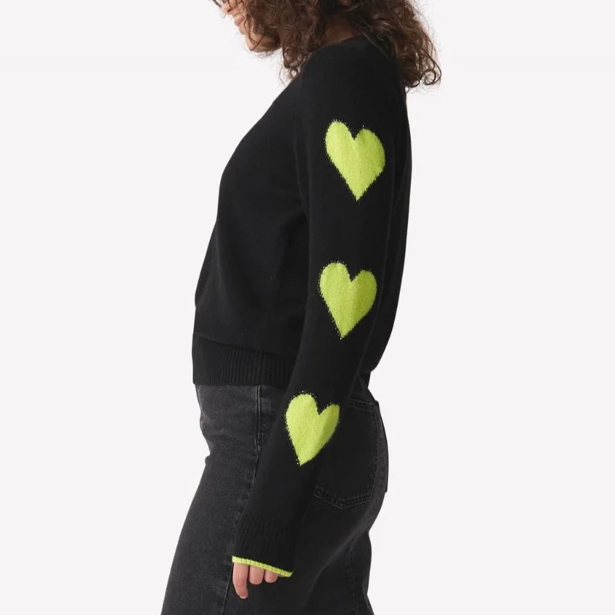 Pixel Heart Sleeve Crew Neck Jumper in Black + Neon Green from Brodie  Perfect for those more casual everyday looks and those glamorous evening styles, this piece will remain with you for seasons to come.  Relaxed fit Crew neckline 100% grade A Mongolian cashmere Clean non-toxic dyes Hand wash Fits true to size